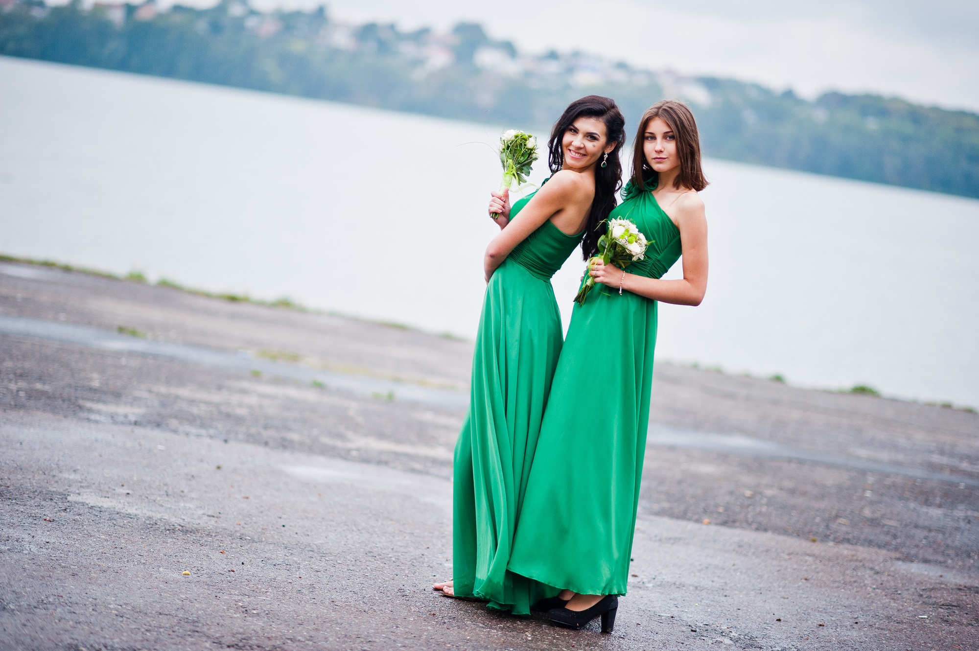 Two charmed girls bridesmaids on green dress