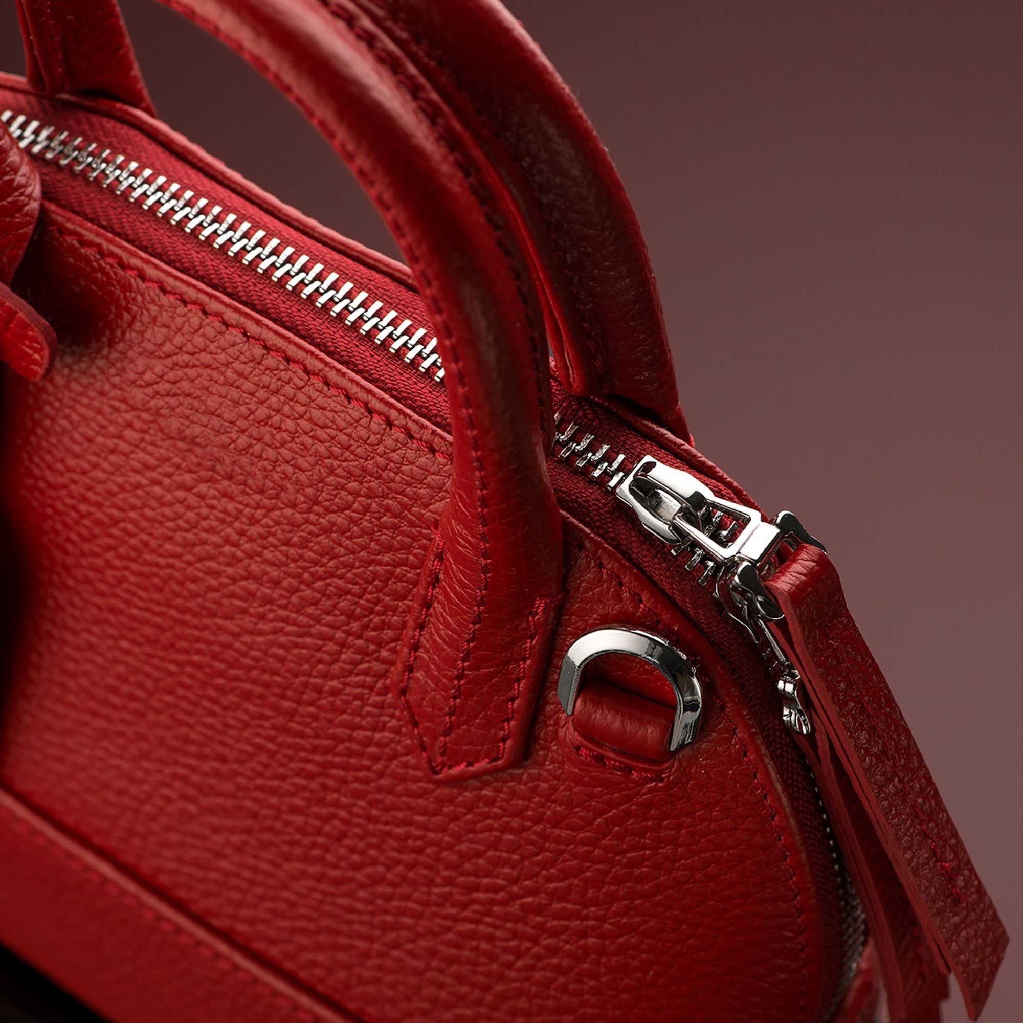 Closeup shot of a luxury red leather bag